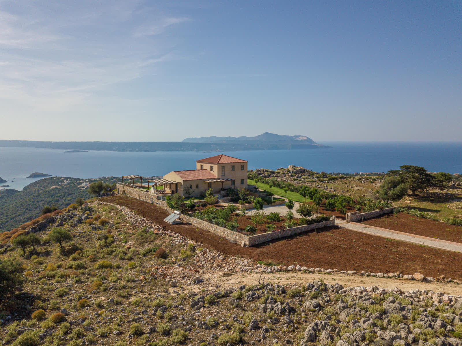Aerial view of the 2000 square metre fenced property and the sea beyond